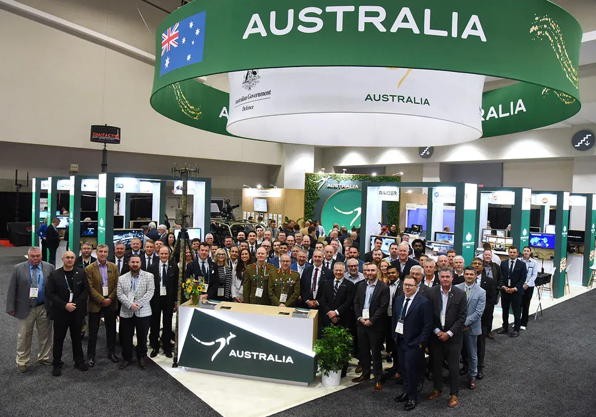 Team Defence Australian delegation standing in a group at AUSA 2024 in Washington DC USA